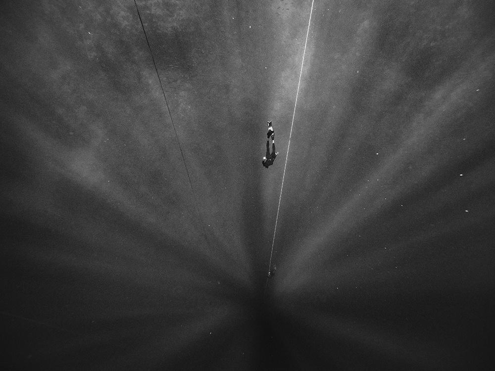 A freediver descends in the Blue Hole