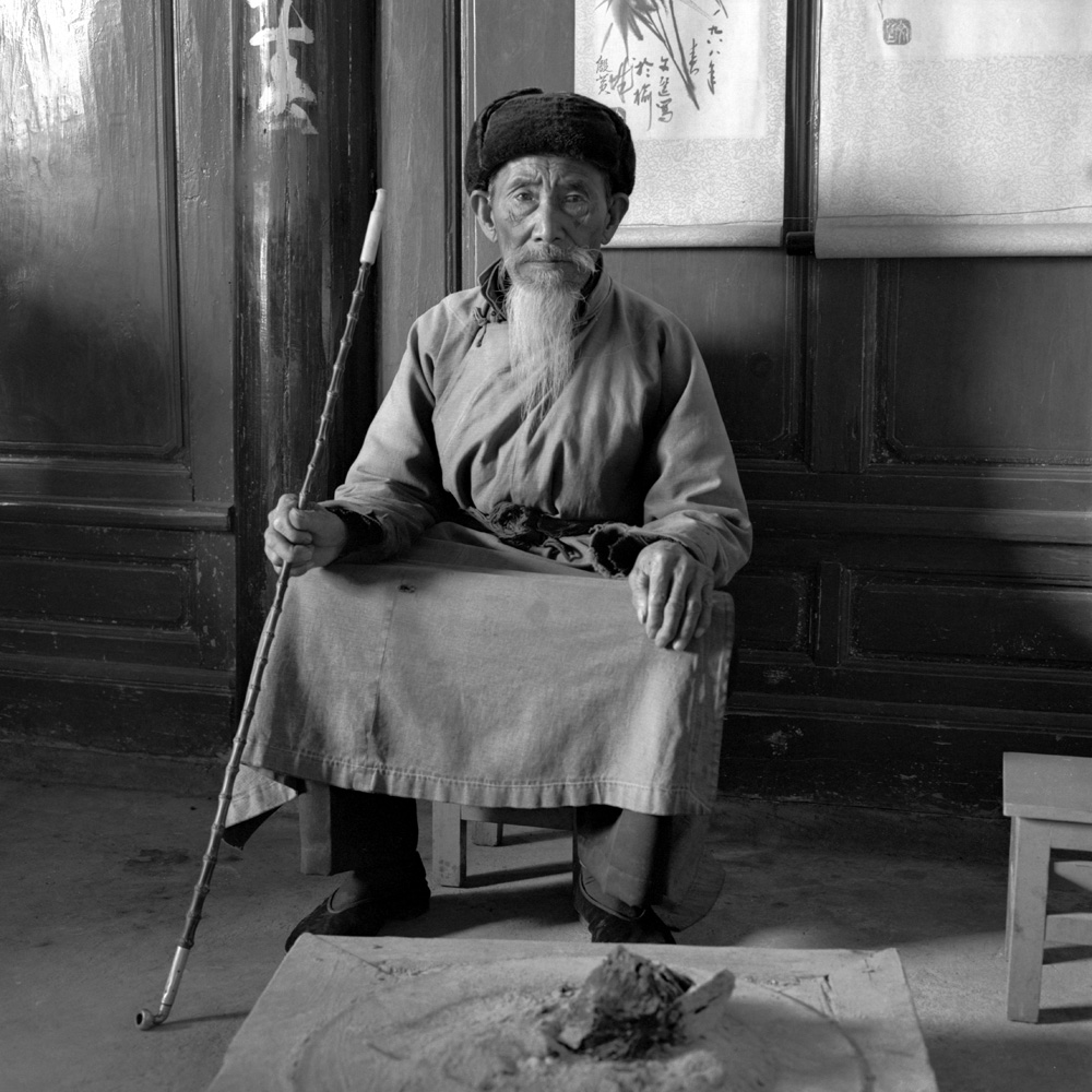 Chinese Man with Pipe