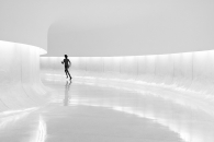 Woman running in a corridor at the museum Oscar Niemeyer - Brazil