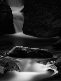 White cloth and black stone in the stream